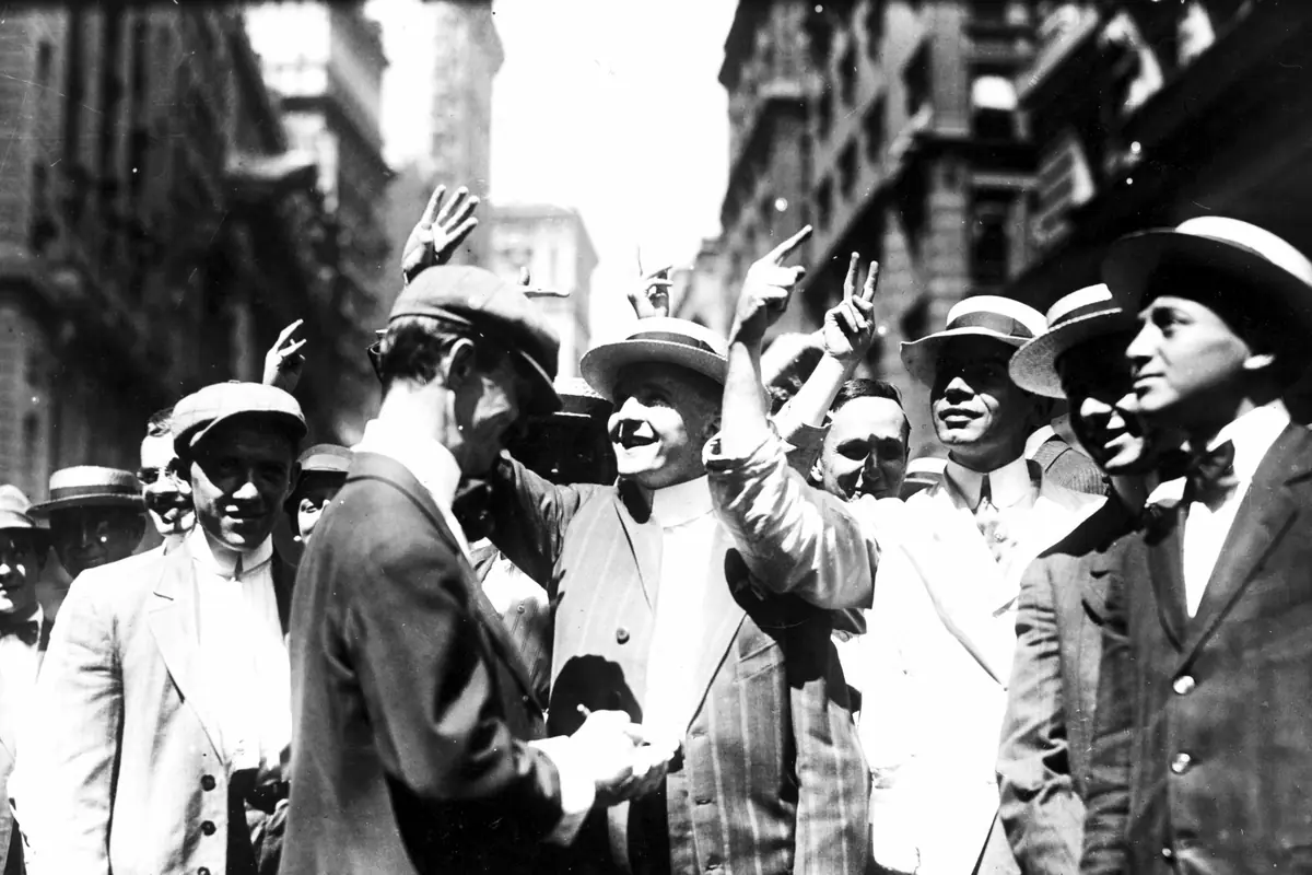 Curb Market brokers signalling with raised hands on Broad Street, New York