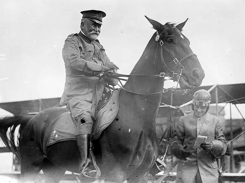 General Fred Grant on horseback beside an aviator in front of a biplane, 1911